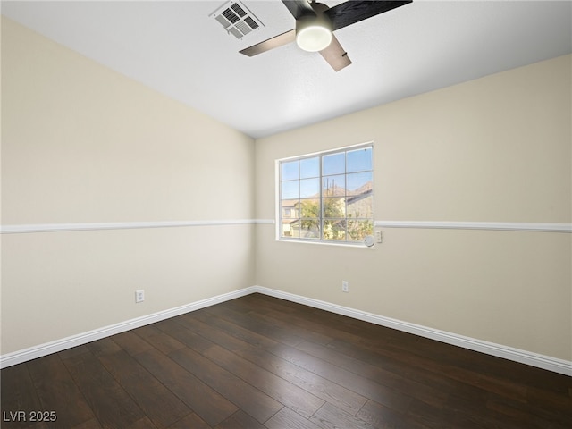 empty room with visible vents, baseboards, a ceiling fan, and hardwood / wood-style flooring