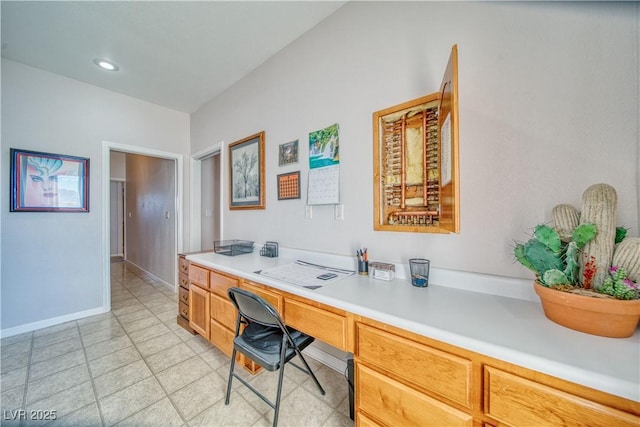 office featuring baseboards and built in study area