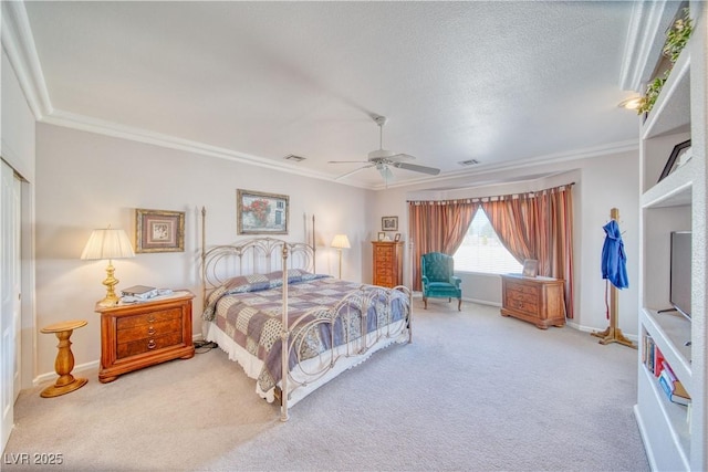 bedroom with visible vents, baseboards, carpet, and ornamental molding