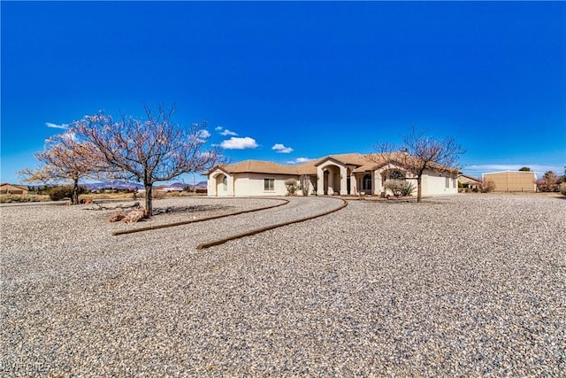 view of front of house featuring stucco siding