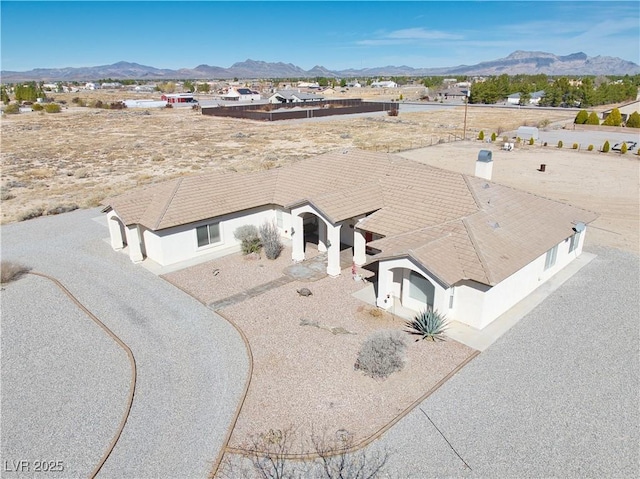 birds eye view of property with a mountain view