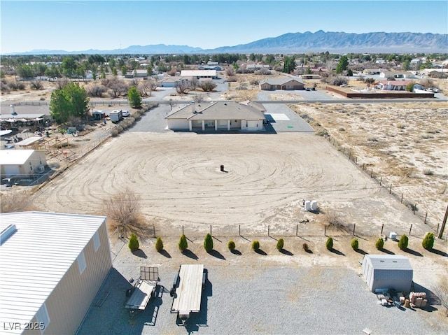 birds eye view of property featuring a mountain view