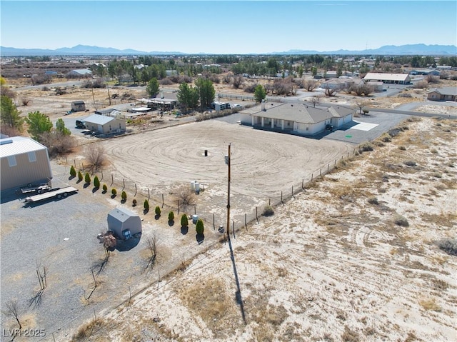 birds eye view of property featuring a mountain view