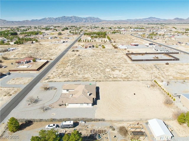 aerial view with a mountain view and view of desert