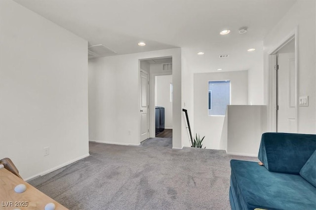 sitting room with baseboards, attic access, carpet floors, an upstairs landing, and recessed lighting