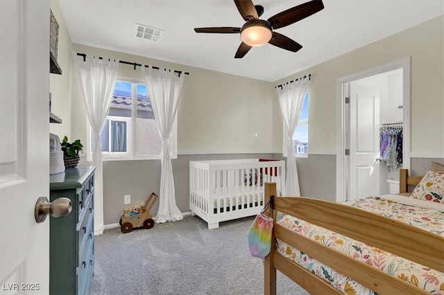 bedroom featuring visible vents, baseboards, carpet, and ceiling fan