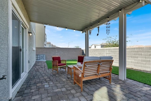 view of patio / terrace with an outdoor hangout area and a fenced backyard