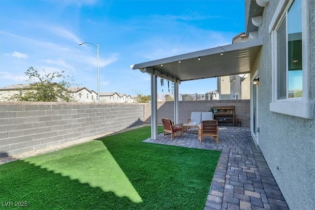 view of yard featuring a patio and a fenced backyard