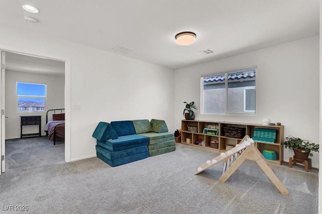 interior space featuring visible vents, carpet floors, and baseboards