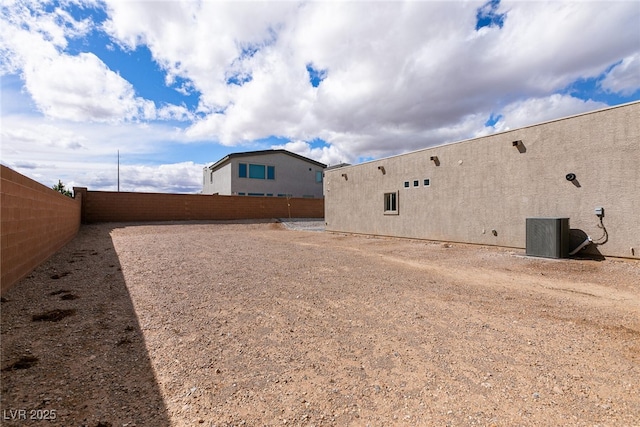 view of yard featuring cooling unit and a fenced backyard