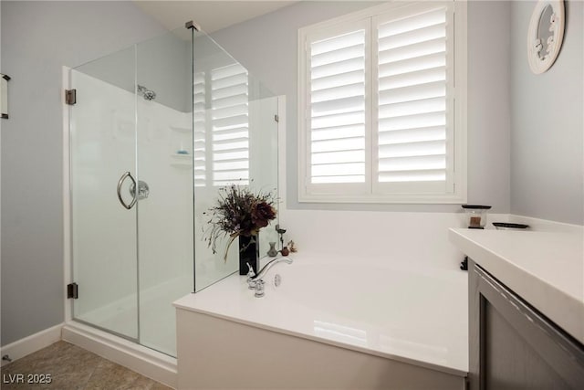 full bath with tile patterned flooring, a stall shower, vanity, and a garden tub