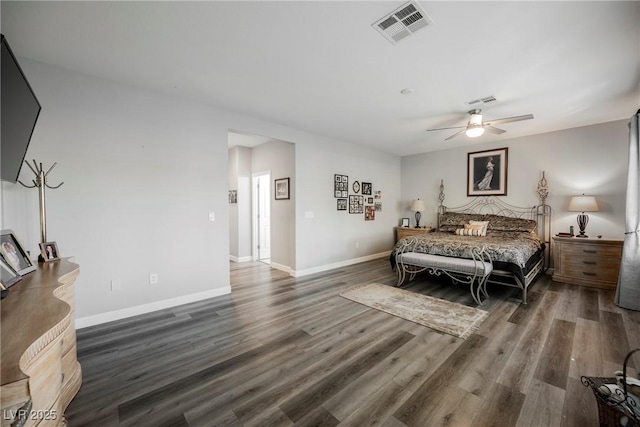 bedroom with visible vents, baseboards, wood finished floors, and a ceiling fan