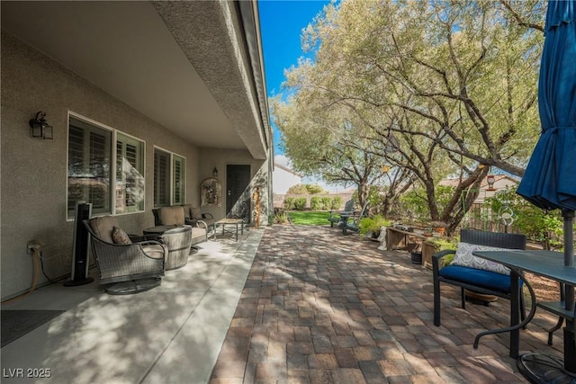 view of patio / terrace with outdoor dining area and an outdoor hangout area