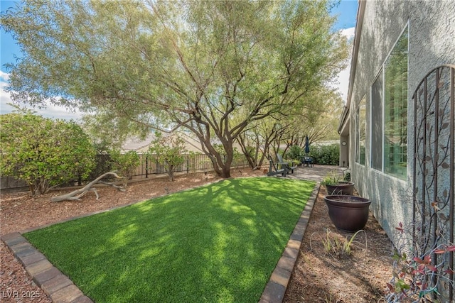 view of yard with a fenced backyard