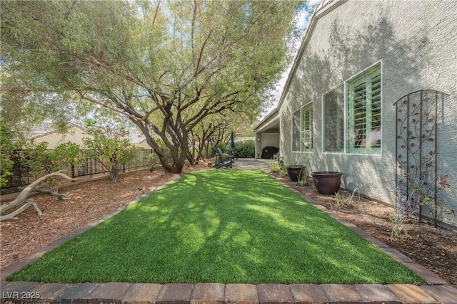 view of yard with a fenced backyard