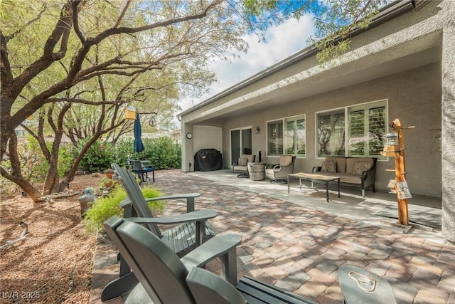 view of patio featuring area for grilling and outdoor lounge area