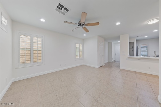 empty room featuring recessed lighting, visible vents, baseboards, and a ceiling fan