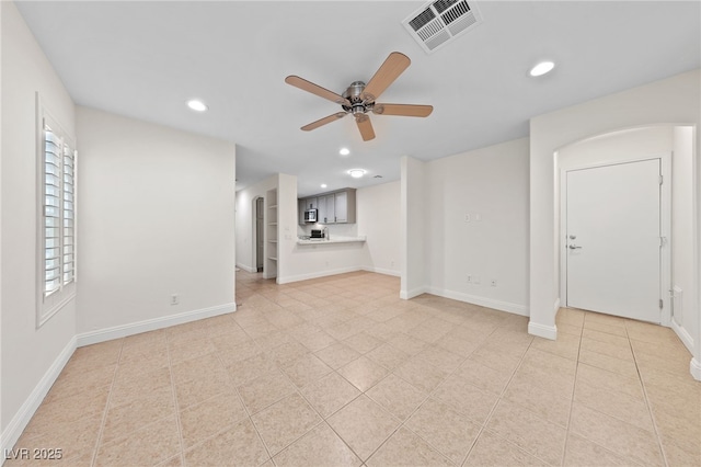 unfurnished living room featuring baseboards, recessed lighting, visible vents, and ceiling fan