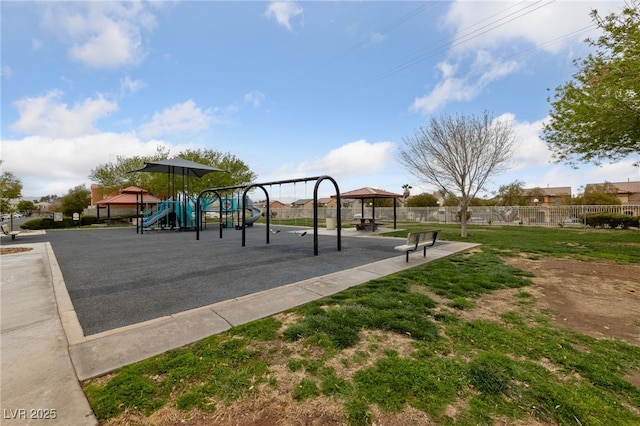 community play area featuring a gazebo and fence