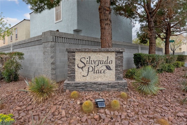 community sign with fence