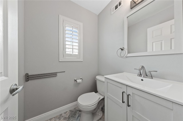 bathroom with visible vents, baseboards, toilet, and vanity