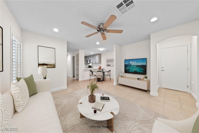 living area featuring recessed lighting, visible vents, ceiling fan, and light tile patterned flooring