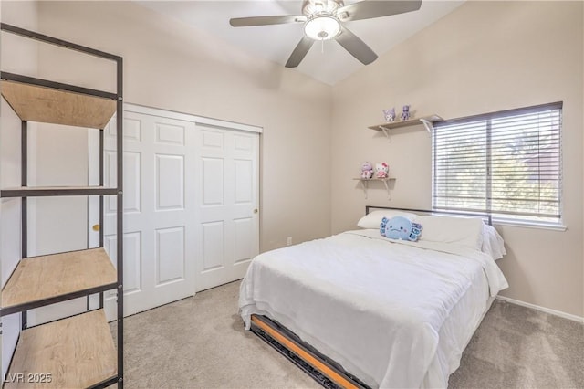 bedroom with a closet, carpet flooring, baseboards, and a ceiling fan