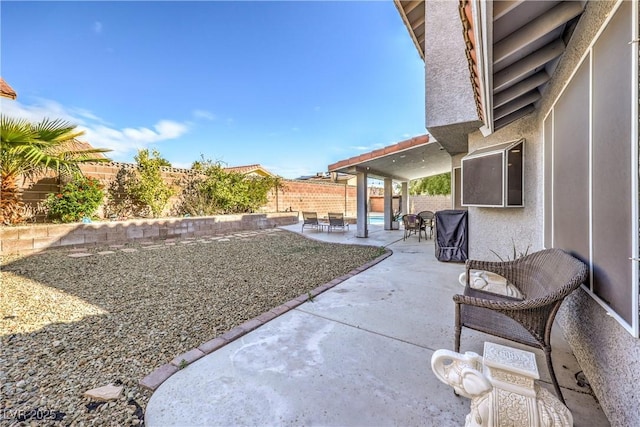 view of yard with a fenced backyard and a patio area