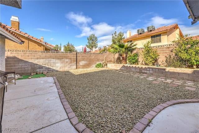 view of yard with a patio and a fenced backyard