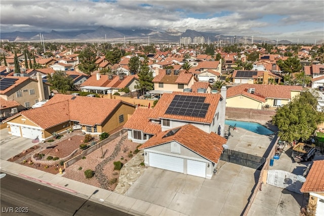 drone / aerial view with a mountain view and a residential view