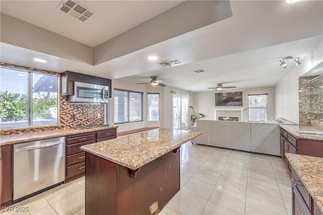 kitchen with tasteful backsplash, visible vents, appliances with stainless steel finishes, and ceiling fan