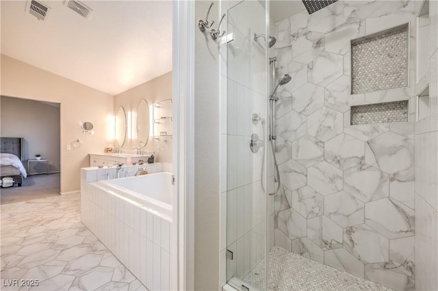 full bath featuring visible vents, marble finish floor, tiled shower, and connected bathroom