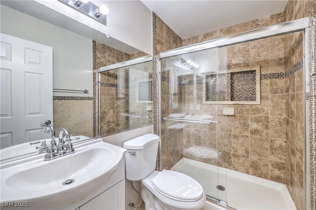 full bath featuring a shower stall, toilet, and vanity