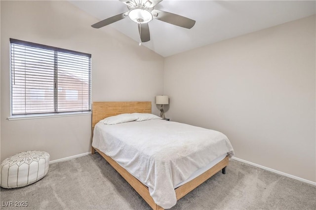 bedroom with baseboards, lofted ceiling, carpet, and a ceiling fan