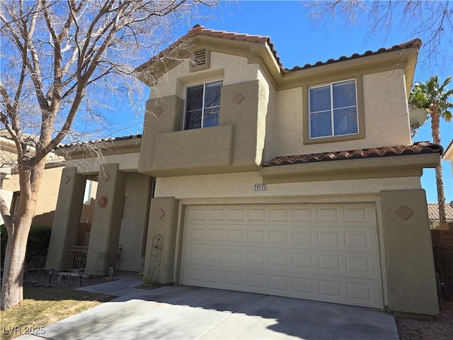 view of front facade featuring a garage, driveway, stucco siding, and a tile roof