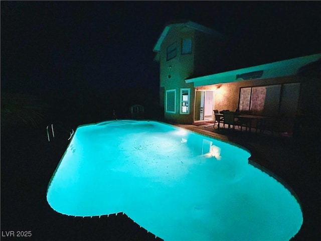 3258 Del Marino St, Las Vegas, NV 89121 - pool at night with an outdoor pool and a patio