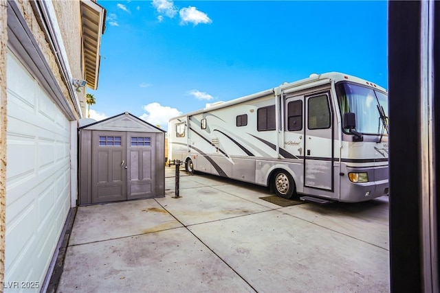3258 Del Marino St, Las Vegas, NV 89121 - view of vehicle parking with a storage shed