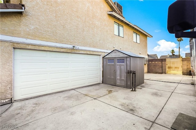 3258 Del Marino St, Las Vegas, NV 89121 - garage featuring a storage unit and a gate