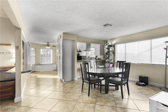 3258 Del Marino St, Las Vegas, NV 89121 - dining room with ceiling fan, a textured ceiling, and light tile patterned floors
