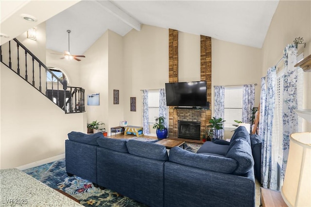 3258 Del Marino St, Las Vegas, NV 89121 - living room featuring high vaulted ceiling, stairway, ceiling fan, a brick fireplace, and beamed ceiling