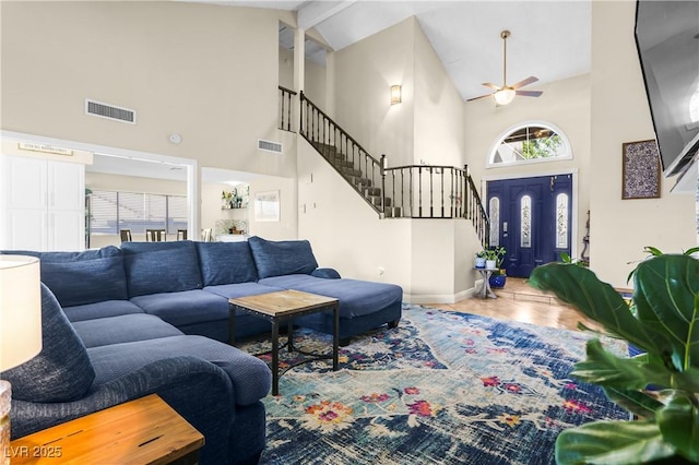 3258 Del Marino St, Las Vegas, NV 89121 - tiled living area featuring high vaulted ceiling, ceiling fan, stairway, and healthy amount of natural light