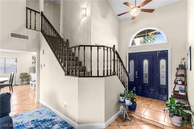 3258 Del Marino St, Las Vegas, NV 89121 - tiled entryway with a towering ceiling, a ceiling fan, and stairs
