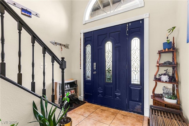 3258 Del Marino St, Las Vegas, NV 89121 - entryway with light tile patterned floors and stairs