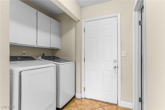3258 Del Marino St, Las Vegas, NV 89121 - washroom featuring washer and dryer, cabinet space, and light tile patterned floors