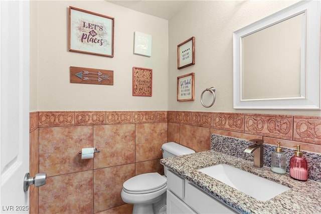3258 Del Marino St, Las Vegas, NV 89121 - half bath with tile walls, vanity, and wainscoting