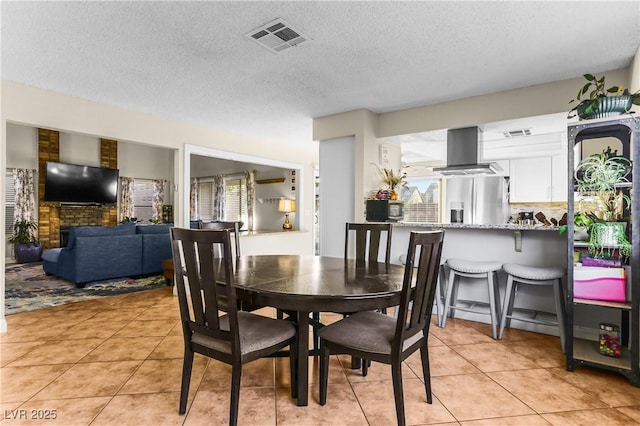 3258 Del Marino St, Las Vegas, NV 89121 - dining space with light tile patterned floors and a textured ceiling