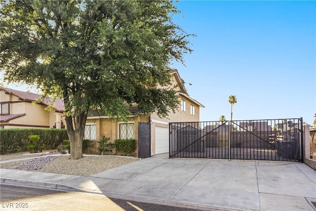 3258 Del Marino St, Las Vegas, NV 89121 - view of front of house featuring stucco siding, concrete driveway, a gate, and a garage