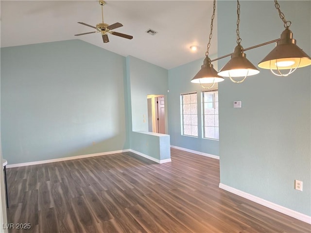 unfurnished room with visible vents, baseboards, wood finished floors, and a ceiling fan