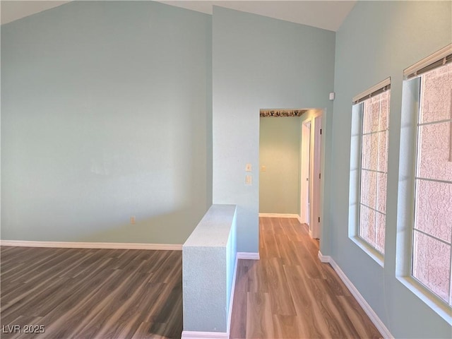 3117 Brightridge Dr, Las Vegas, NV 89134 - hall with wood finished floors, plenty of natural light, baseboards, and high vaulted ceiling