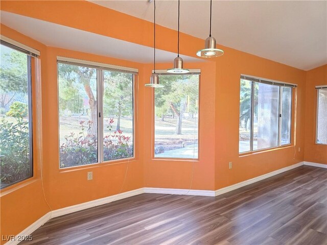 3117 Brightridge Dr, Las Vegas, NV 89134 - unfurnished dining area featuring dark wood-style flooring, baseboards, and vaulted ceiling
